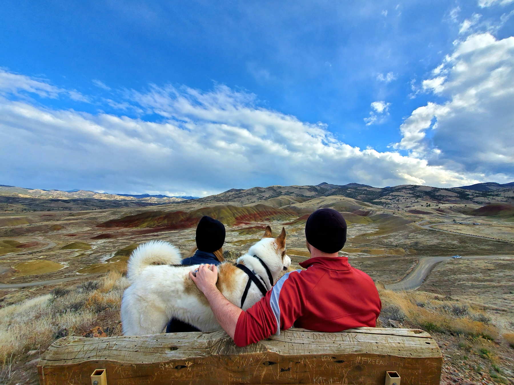 Aubrie Piper, Akira and Charlie Beckers look out over the Painted Hills of Oregon. 