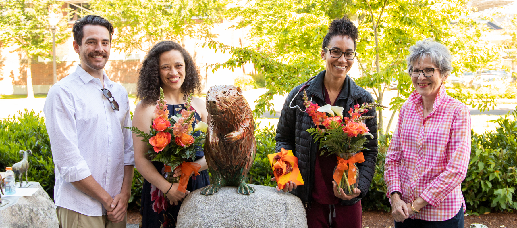 Drs. Trevor Pereyda, MaryAlice Coulter and Tandi Ngwenyama pose with Rebecca Camden