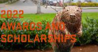 Photo of bronze beaver statue with the words Awards and Scholarships.