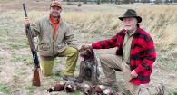 Jordan Beamer, his hunting dog Jax and dad Dr. Leland Bud Beamer pose after a successful pheasant hunt