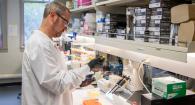 Dr. Brian Dolan pipetting in his laboratory