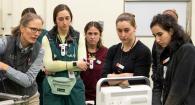 Dr. Katja Duesterdieck-Zellmer consults with the full team as she performs the ultrasound. 
