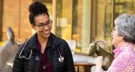 Dr. Tandi Ngwenyama speaks with Rebecca Camden at an award ceremony.