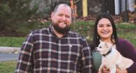 Miriam Barbour poses with her husband three dogs. 