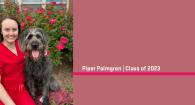 Piper Palmgren and pet dog pose in front of a blooming rose bush. 