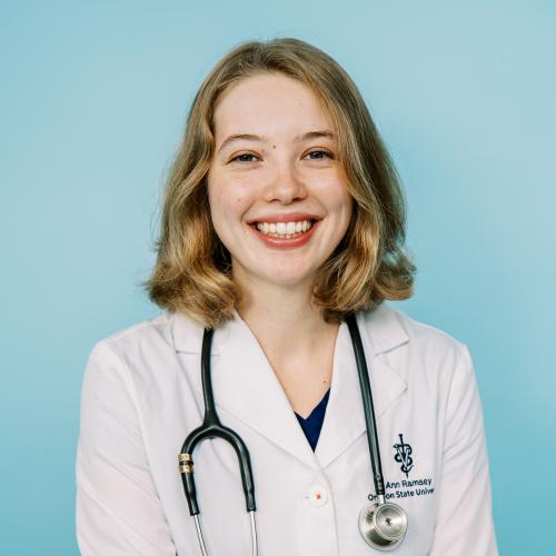 Ann Ramsey portrait in white coat and stethoscope.